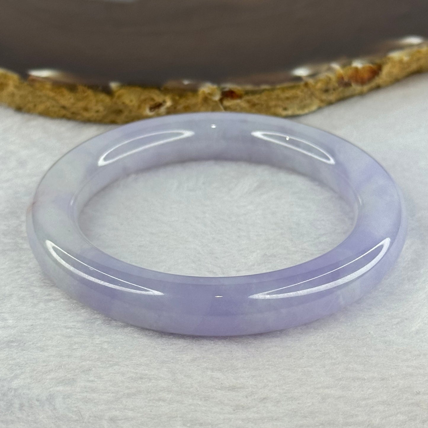 Type A Faint Lavender with Bright Lavender and Brownish Orange Jadeite Bangle 58.04g 290.29cts Internal Diameter 54.5mm 10.5 by 10.5 With NGI Cert No 32880442 (Slight Internal Line)