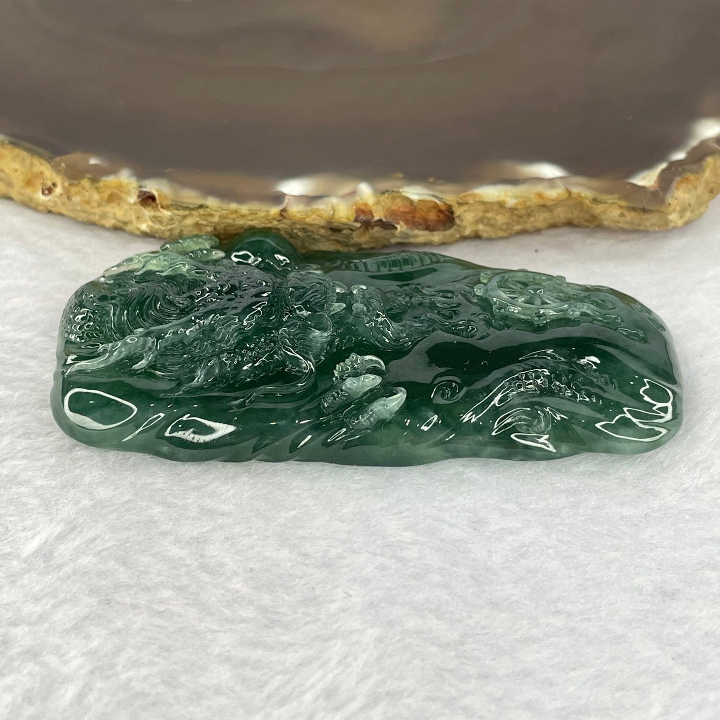 Very Rare High Icy Grand Master Type A Blueish Green Jadeite Fire Dragon with Fortune Wheel 53.03g 73.4 by 38.7 by 11.5mm with Wooden Stand