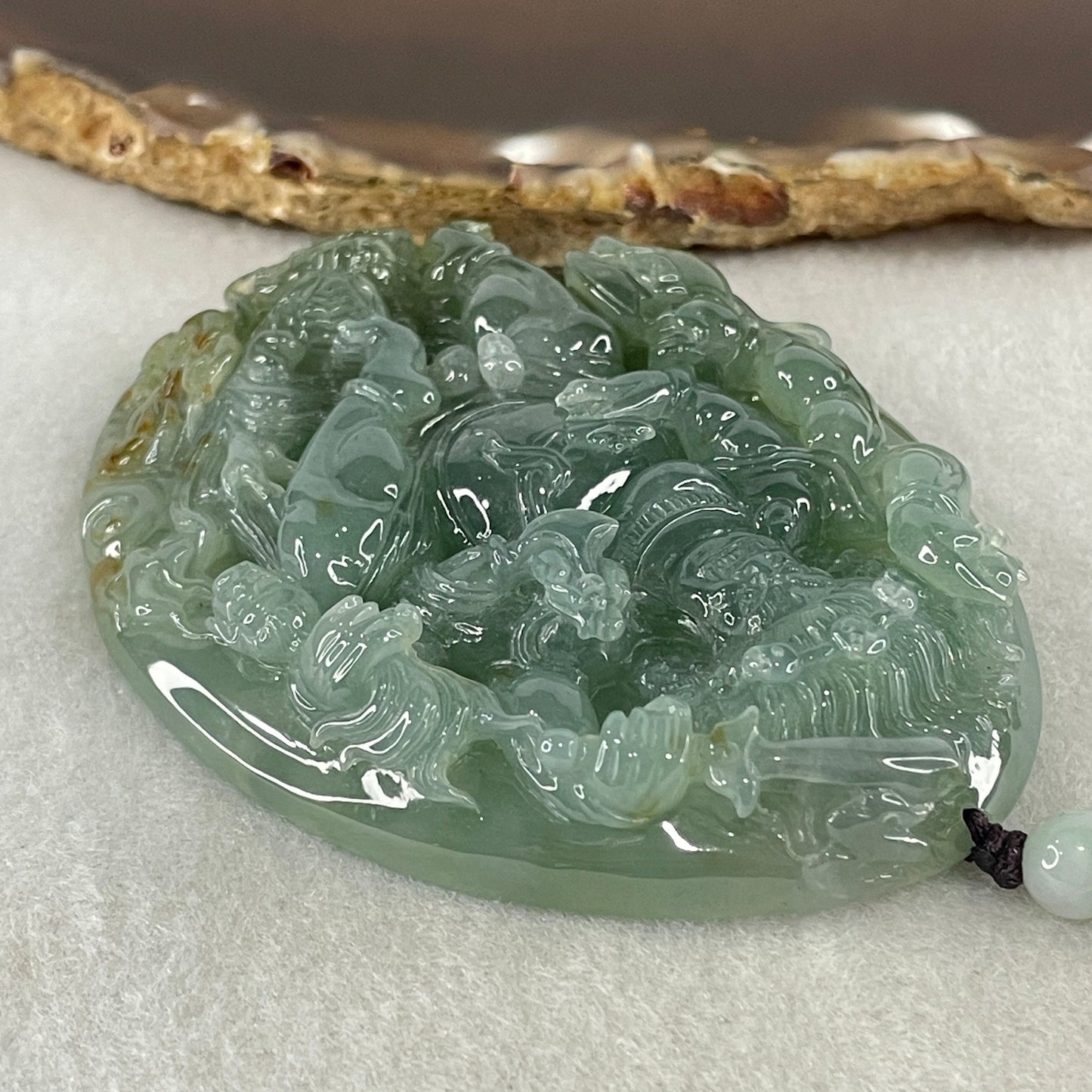 Grand Master Type A Icy Blueish Green with Brown Patches Jadeite Acala Pendant 85.25g 75.0 by 56.6 by 12.4mm