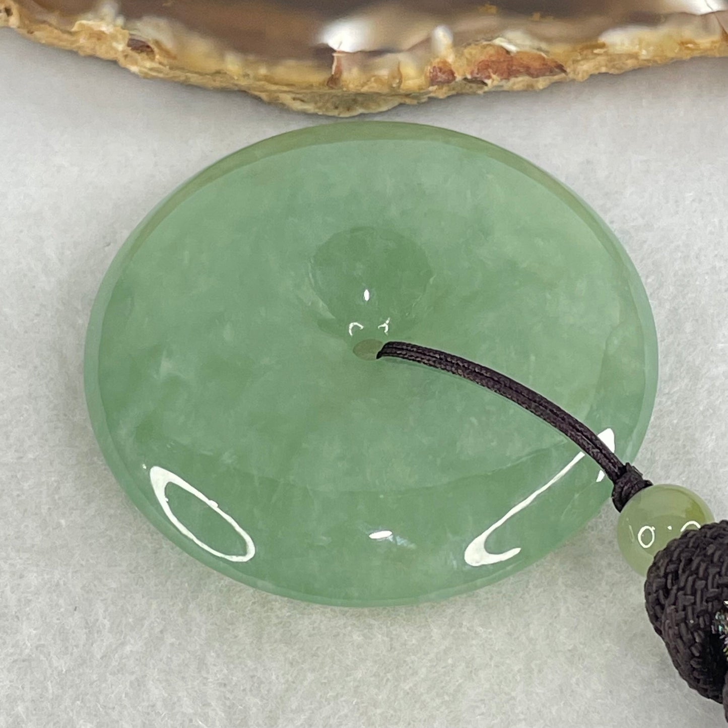 Type A Semi Icy Blueish Green Jadeite Ping An Kou Donut Pendant 48.87g 49.6 by 10.0mm (Perfect)