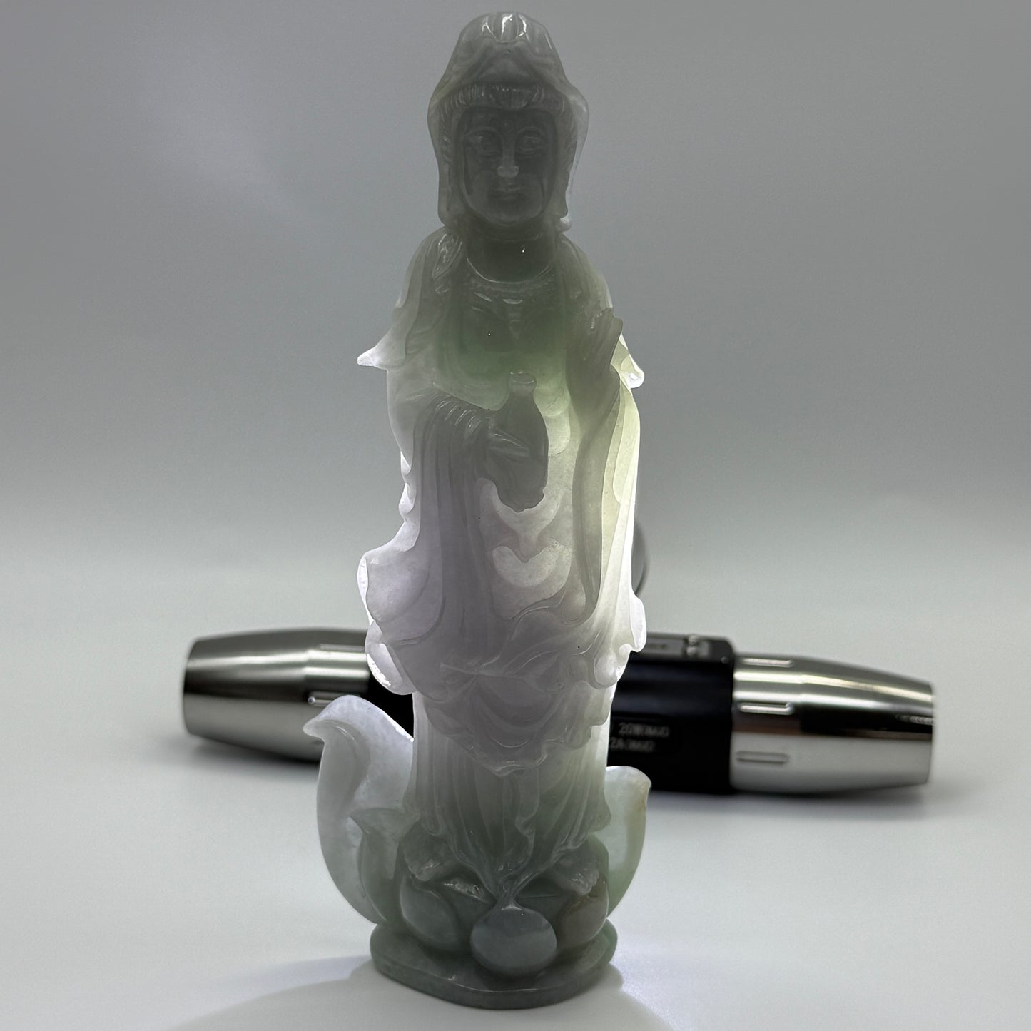 Type A Lavender and Green Jade Jadeite Guan Yin Display 210.5g 142.6 by 53.6 by 24.1mm with wooden stand total 1515g 310 by 152 by 106mm