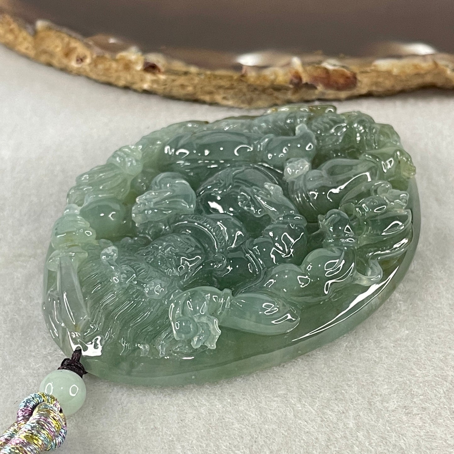 Grand Master Type A Icy Blueish Green with Brown Patches Jadeite Acala Pendant 85.25g 75.0 by 56.6 by 12.4mm