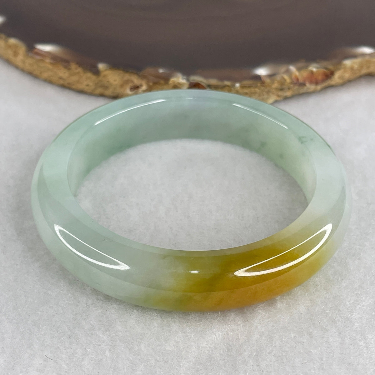 NGI Certified Very High Grade Natural Type A Semi Icy Blueish Green with Yellowish Brown Patches Jadeite 59.58g Inner Diameter 54.30mm 12.6 by 8.6mm (Very Very Slight Internal Line)
