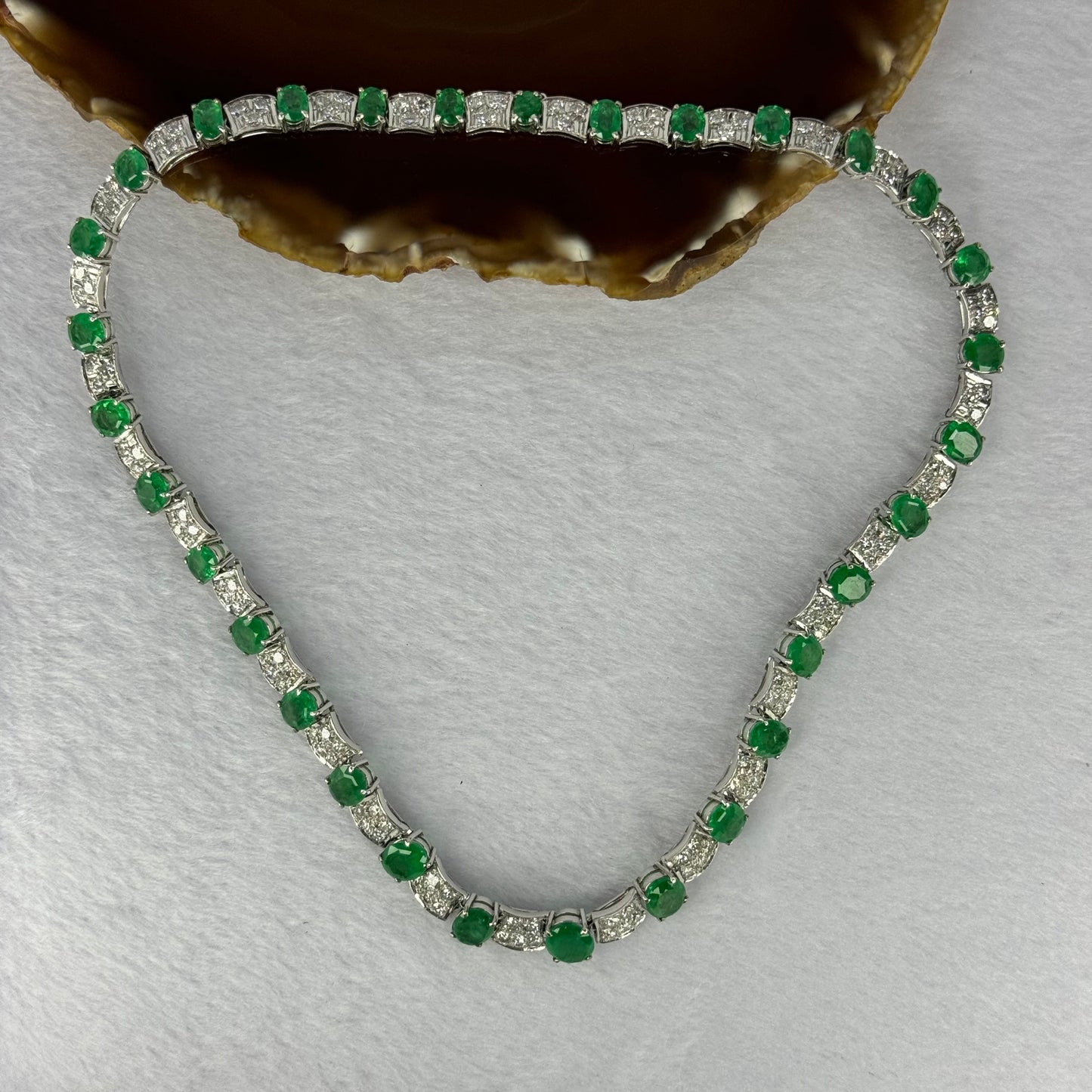 Natural Emeralds (Beryl) 25.0 cts. Total 42.34g including 31 Emeralds, 121 Natural Diamonds in 8k White Gold with NGI Cert No. 82835786