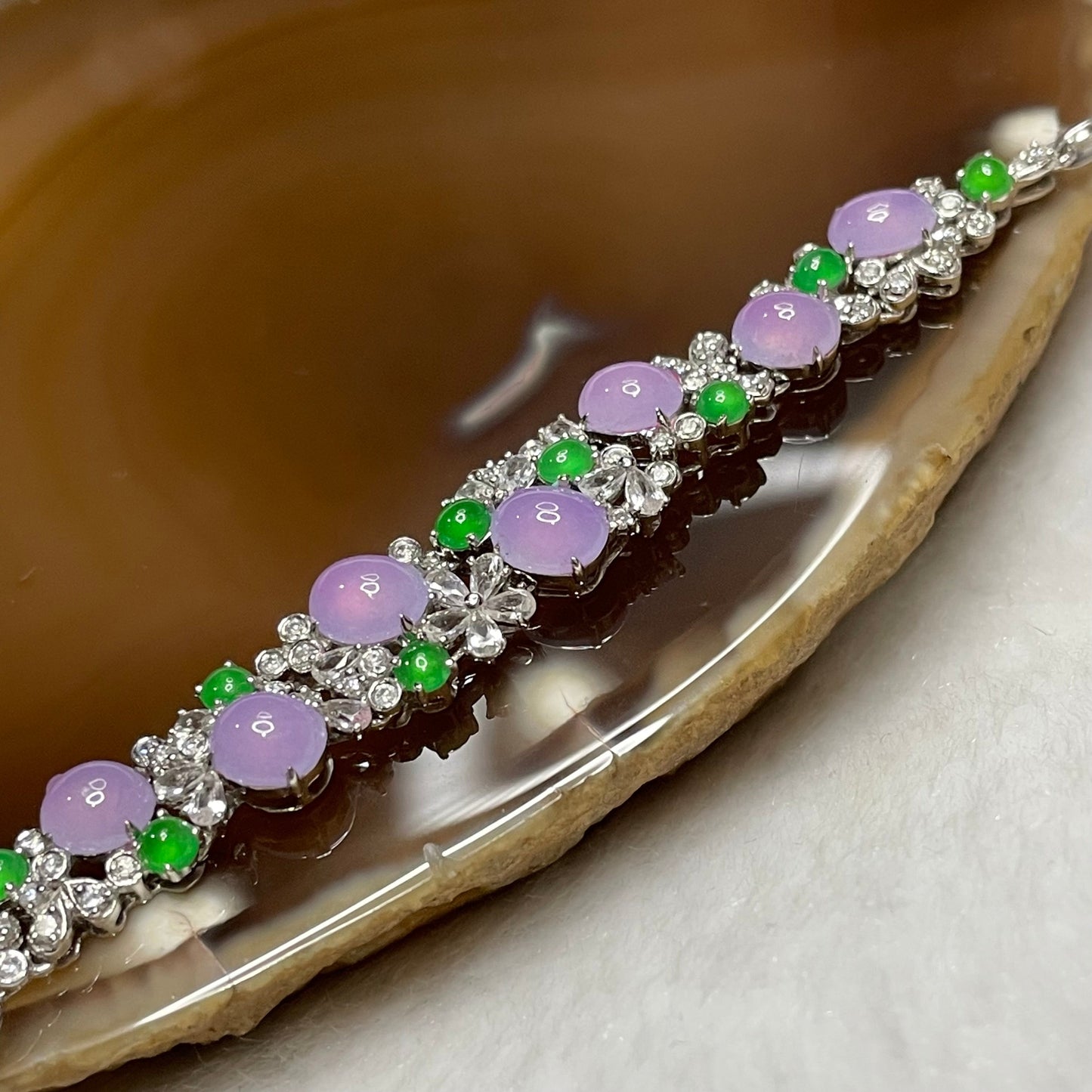 RARE Type A Semi Icy Lavender & Green Jade Jadeite Bracelet 18k white gold, natural diamonds & sapphires 7.23g Dimensions of middle piece: 88.2 by 9.2 by 4.7mm Length of Bracelet: 16cm