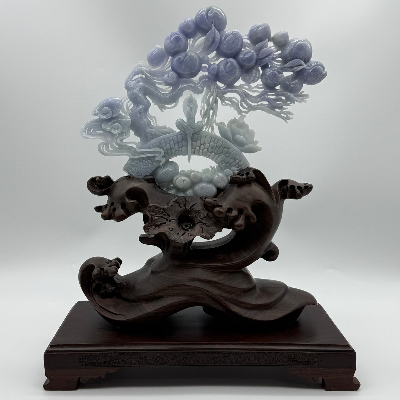 Rare Type A Natural Old Pit Deep Lavender Jadeite Gui Ren with Longevity Peaches and Lotus 470.0g 23.0 by 19.0 by 1.36cm with wooden stand 2285g 25.0 by 12.0 by 32.0cm
