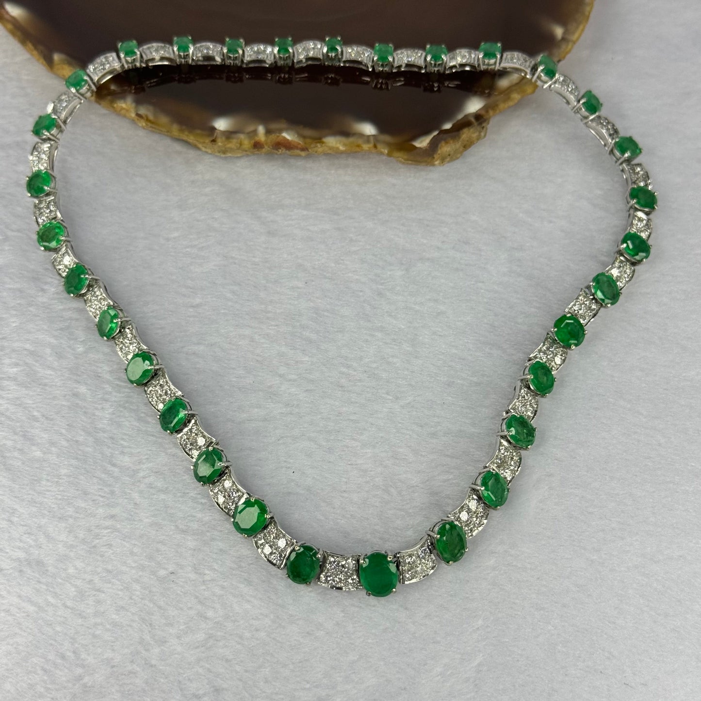 Natural Emeralds (Beryl) 25.0 cts. Total 42.34g including 31 Emeralds, 121 Natural Diamonds in 8k White Gold with NGI Cert No. 82835786