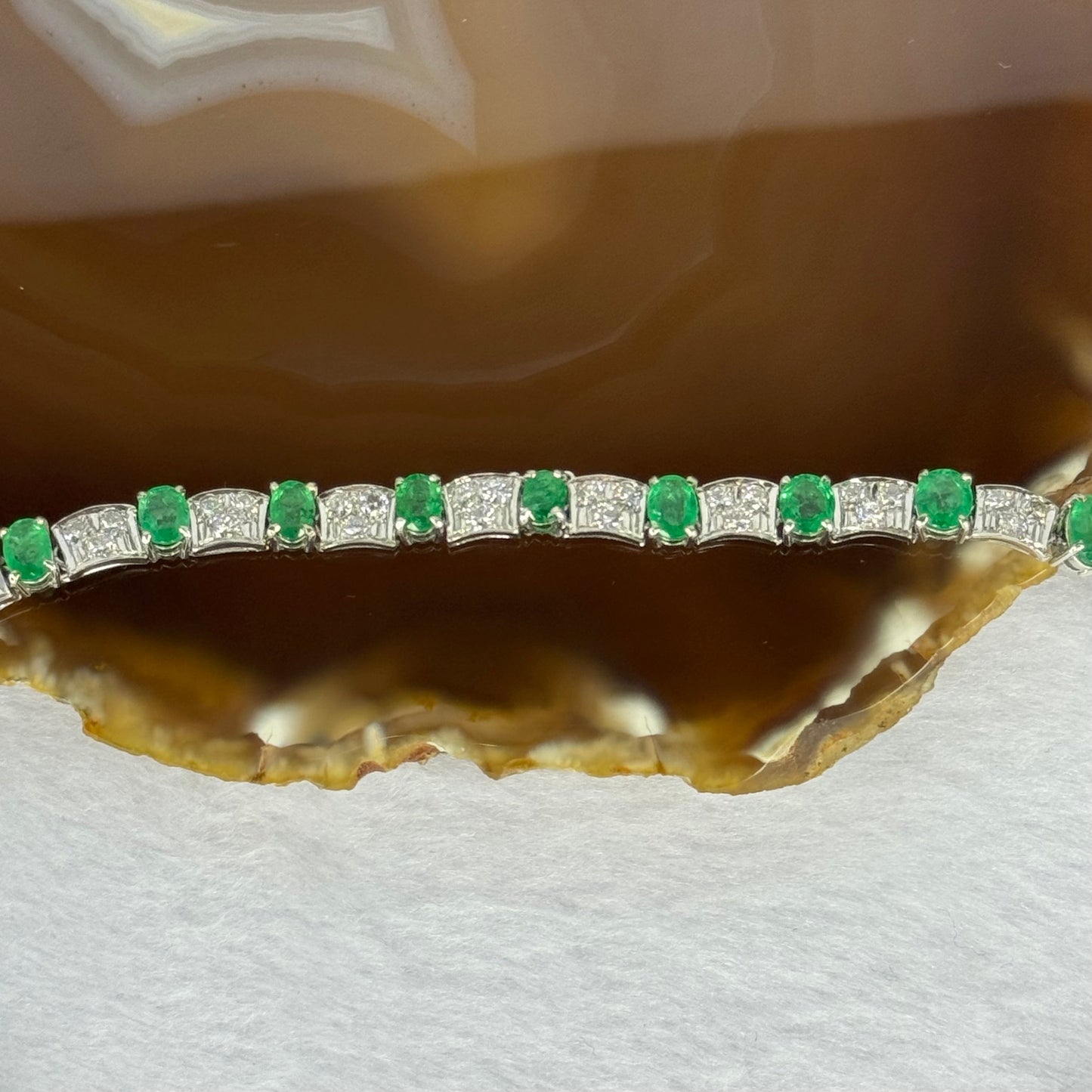 Natural Emeralds (Beryl) 25.0 cts. Total 42.34g including 31 Emeralds, 121 Natural Diamonds in 8k White Gold with NGI Cert No. 82835786