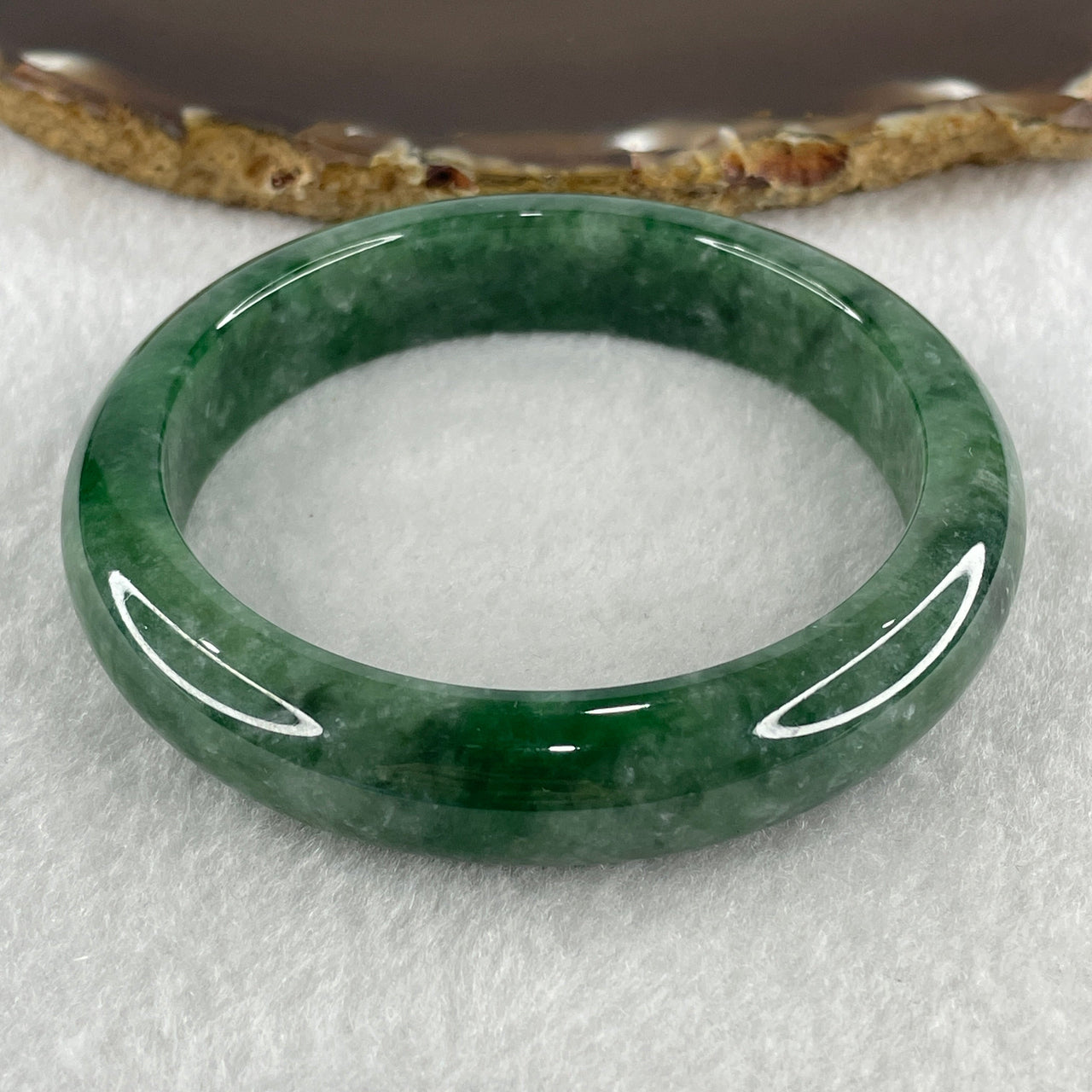 Certified Type A Natural Green with Emerald Green Patches Jadeite Bangle 323.63ct 64.72g Inner Diameter 58.9mm Thickness 13.0 by 8.5mm (Close to Perfect) with NGI Cert