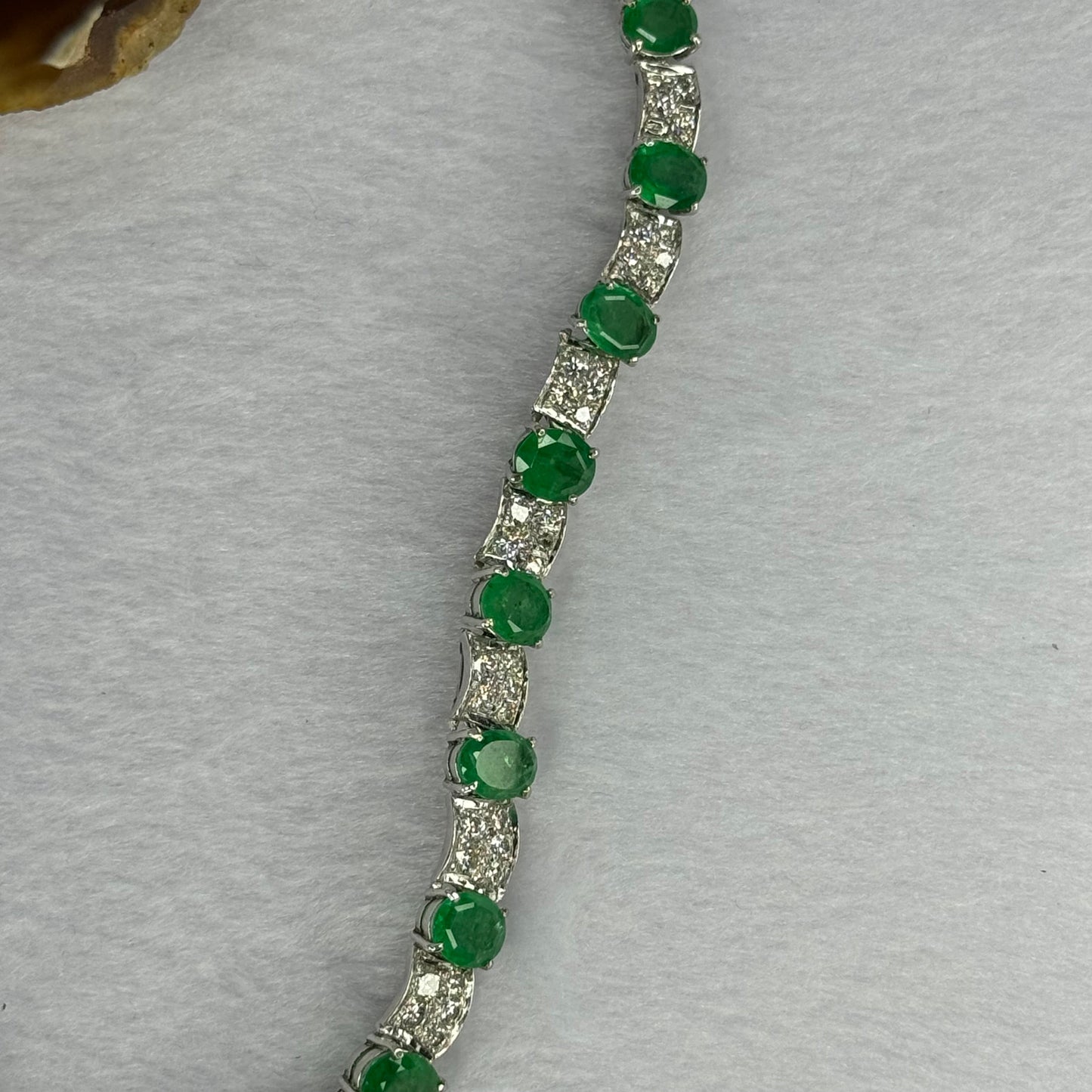 Natural Emeralds (Beryl) 25.0 cts. Total 42.34g including 31 Emeralds, 121 Natural Diamonds in 8k White Gold with NGI Cert No. 82835786
