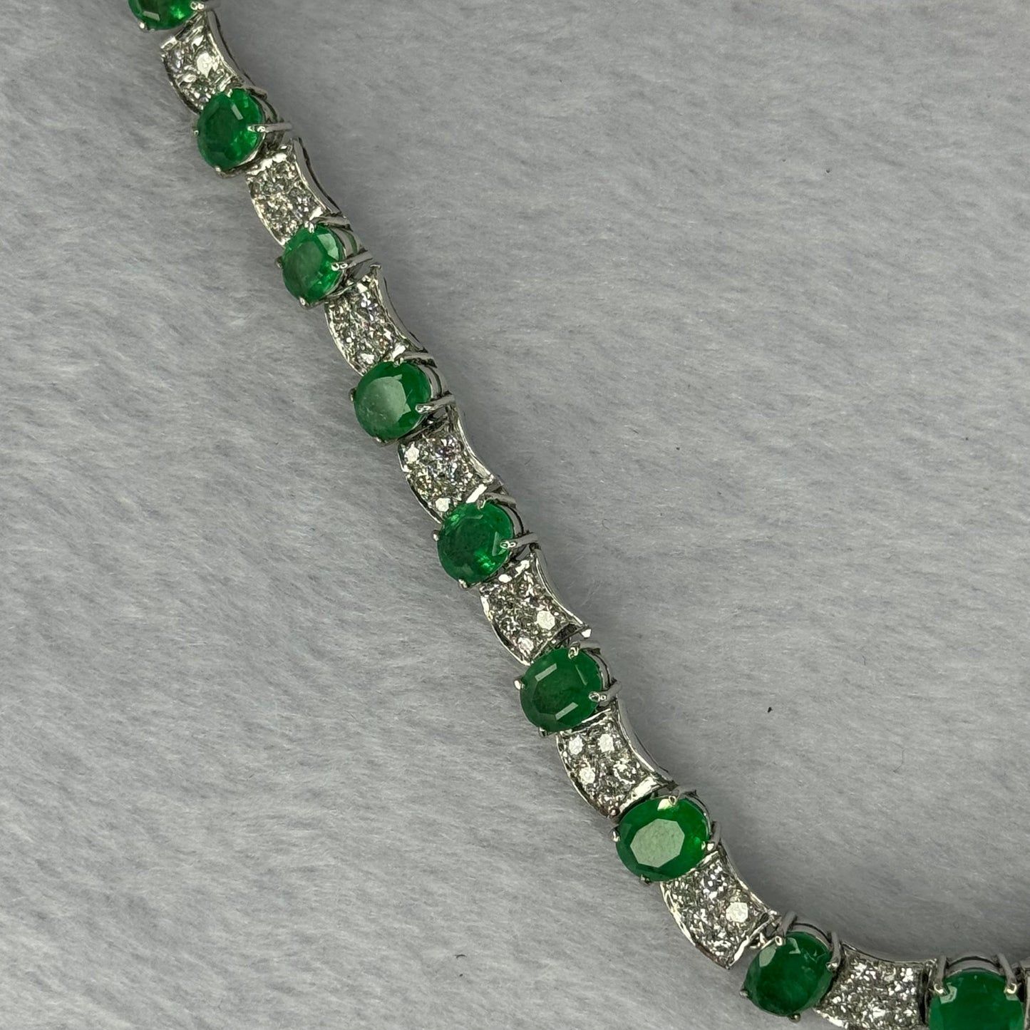 Natural Emeralds (Beryl) 25.0 cts. Total 42.34g including 31 Emeralds, 121 Natural Diamonds in 8k White Gold with NGI Cert No. 82835786