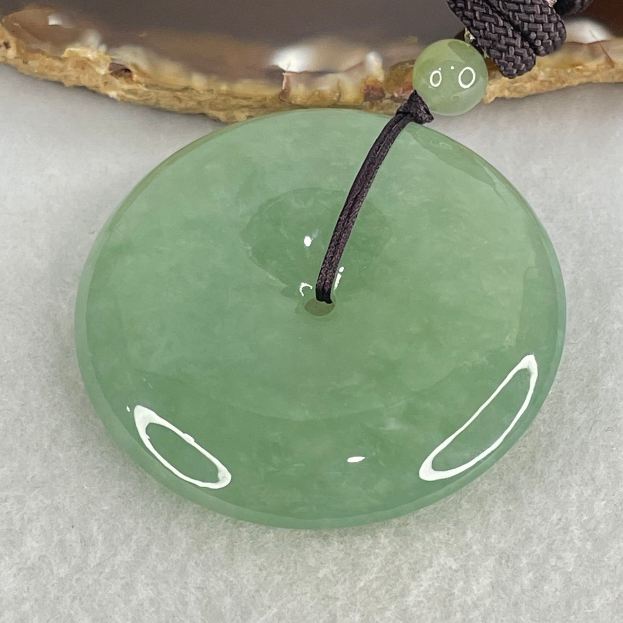 Type A Semi Icy Blueish Green Jadeite Ping An Kou Donut Pendant 48.87g 49.6 by 10.0mm (Perfect)