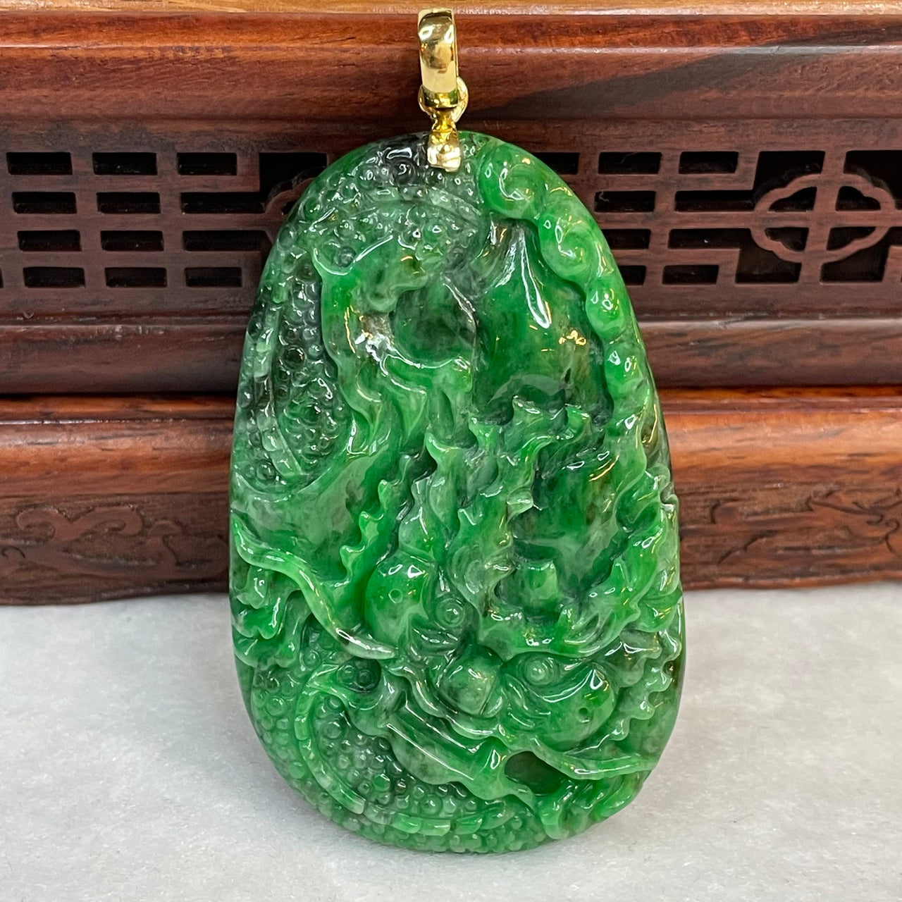 18K Yellow Gold Rare Type A Old Mine Lao Keng Spicy Green with Dark Green Patches Jade Jadeite Prosperity Dragon Feng Shui Pendant with NGI Cert 142.63 cts 57.91 by 36.09 by 7.43mm