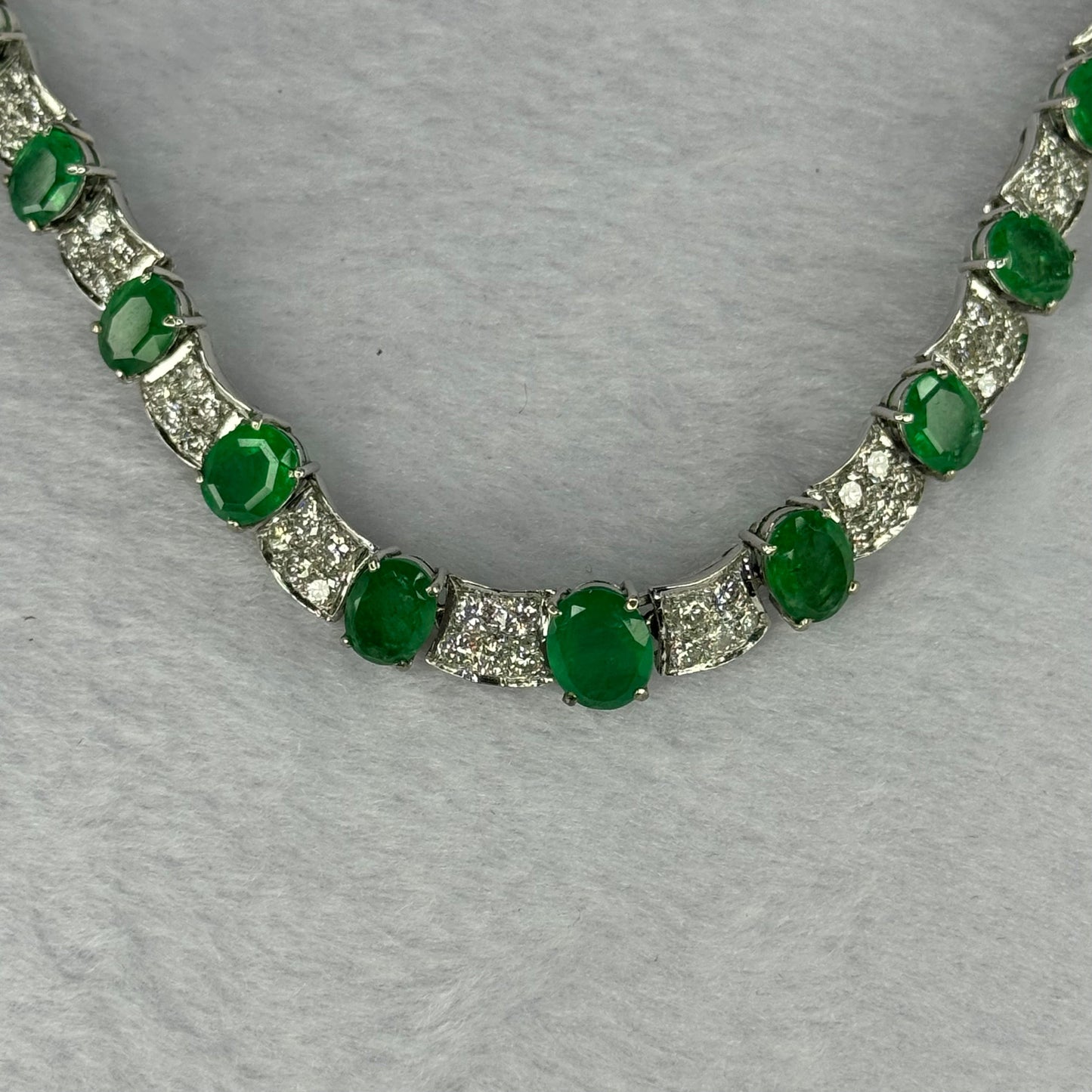 Natural Emeralds (Beryl) 25.0 cts. Total 42.34g including 31 Emeralds, 121 Natural Diamonds in 8k White Gold with NGI Cert No. 82835786