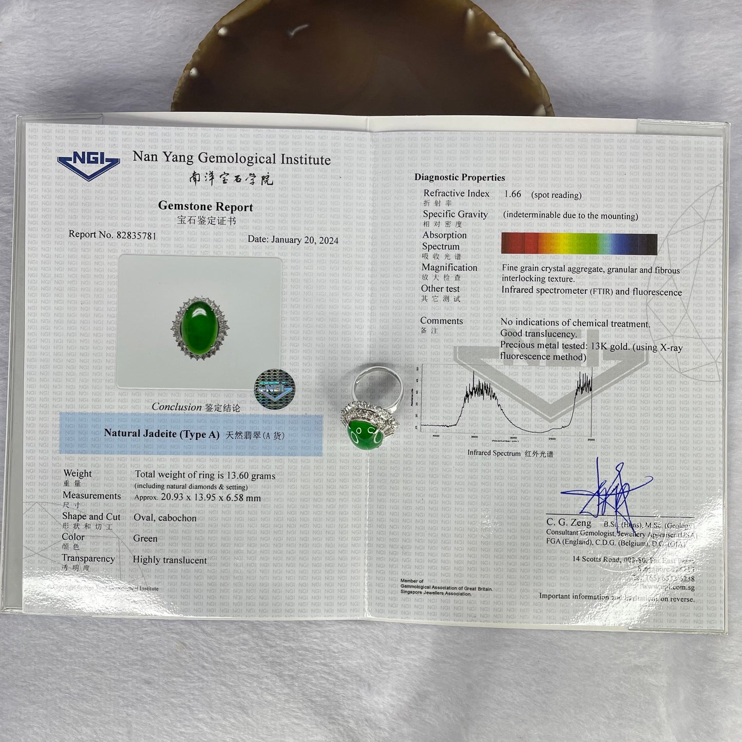 Very Very High Quality Highly Translucent TYPE A Natural Full Intense Green Jadeite Traded as Imperial Green Oval Cabochon Approx. 20.93 by 13.95 by 6.58mm Total Weight 13.60g including Natural Diamonds and 13K White Gold Ring Setting US7.75 HK17 NGI Cert