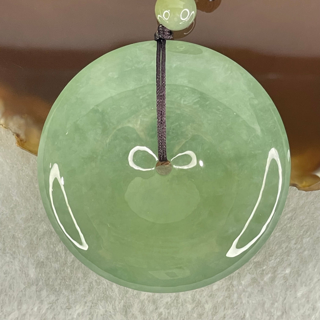 Type A Semi Icy Blueish Green Jadeite Ping An Kou Donut Pendant 48.87g 49.6 by 10.0mm (Perfect)